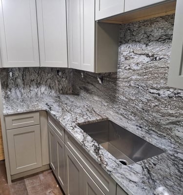 granite countertops with custom full height backsplash