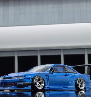 closeup photo of 1/64 mortal model of Nissan Silvia S14