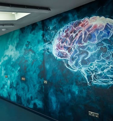 Dark teal mural in modern R&D interior, showing stormy clouds and a stylised brain with pink highlighted areas.