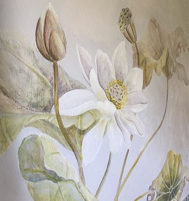 Close-up on a mural with a large lotus flower and large lily pads, painted in a watercolour effect.