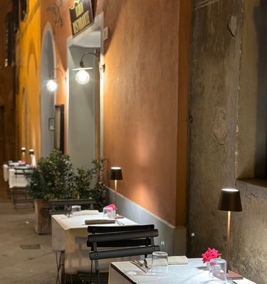 a restaurant with tables and chairs and a lamp