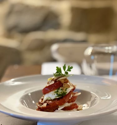 a plate of food on a table with a glass of water