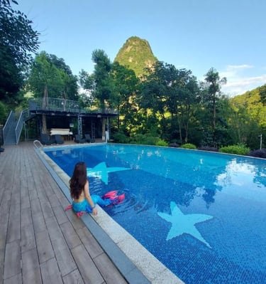 Imagine winding down in the pool by the Li River and taking in the stunning scenery of Yangshuo