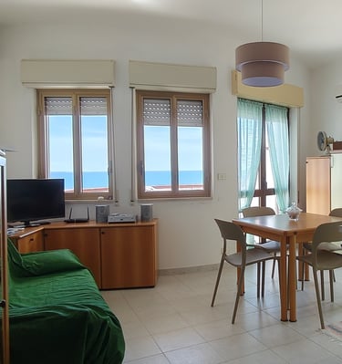 a kitchen and dining room with a table and chairs
