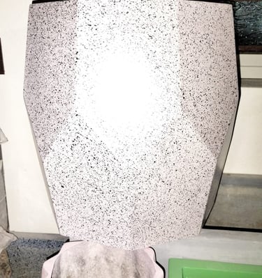 a toilet with a white toilet paper towel