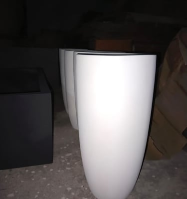 a white vase with a black and white vase