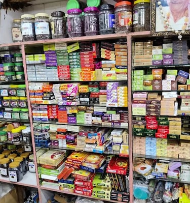 Shelves in a local shop stocked with various incense sticks, fragrance oils, and traditional aromatic jars.