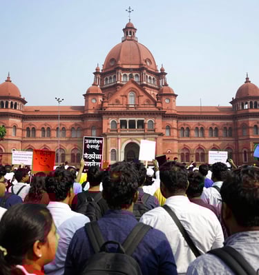 Mr. Rahul Kulkarni consulting with clients in a well-lit Bombay High Court office