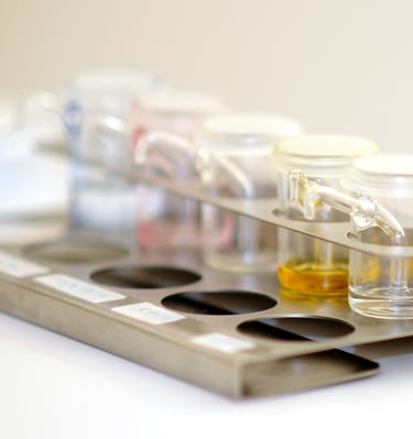 a tray with a variety of different colored liquids