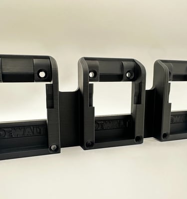 Black 3D printed triple battery wall mount organizer for DeWalt 20V power tool batteries.