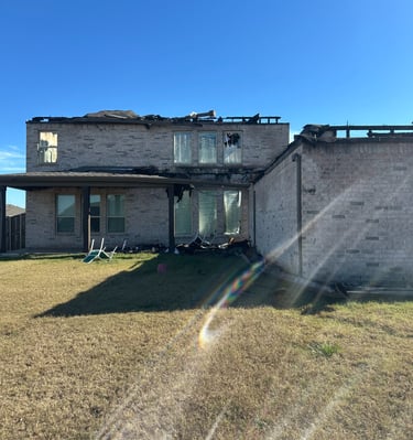 lightning fire damaged home side view Sunnyvale TX - Irvin Restoration complete structural rebuild DFW