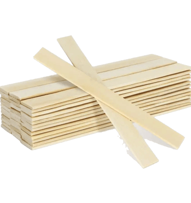Stack of flat natural wooden craft sticks for DIY modeling and art projects.