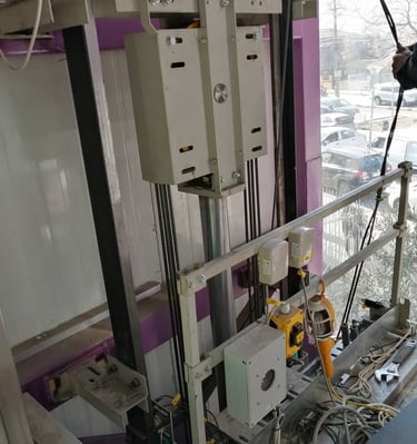 a man in a suit is standing in front of a window