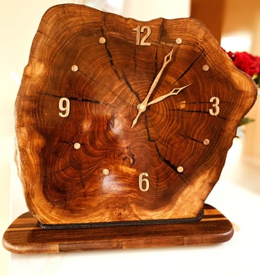 Edged wooden slab clock for table or shelf.