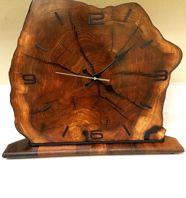 Edged wooden slab clock for table or shelf.