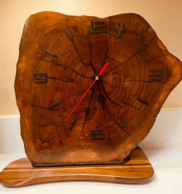 Edged wooden slab clock for table or shelf.