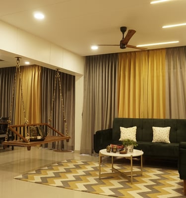 a living room with a couch and a ceiling fan