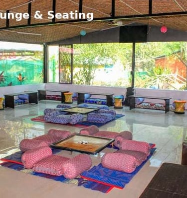indoor lounge area at Jungle Lore Resort with comfortable seating and group space