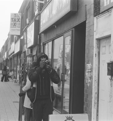 a man taking a picture of a woman on the phone