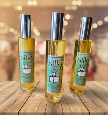 three bottles of silky body oil