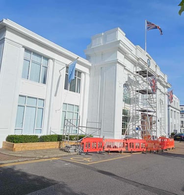 Commercial exterior repainting of art‑deco white building in Croydon by Pure Perfection