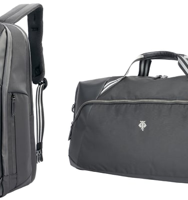 A sleek black backpack and duffle bag with white stripes and silver zippers are side by side .