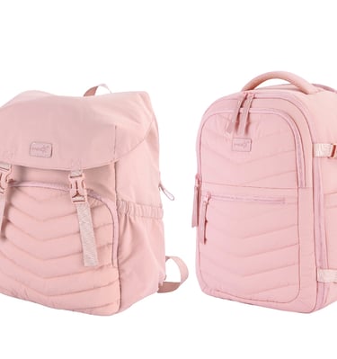 Four light pink bags are lined up: a duffel, a drawstring backpack, a zippered backpack, and a tote.