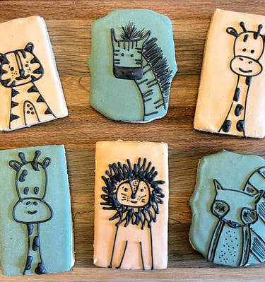Simply adorable cookies for a kid's birthday party. Cartoon animals on light backgrounds
