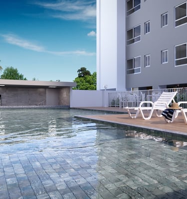 a pool with chairs and a person sitting on a deck