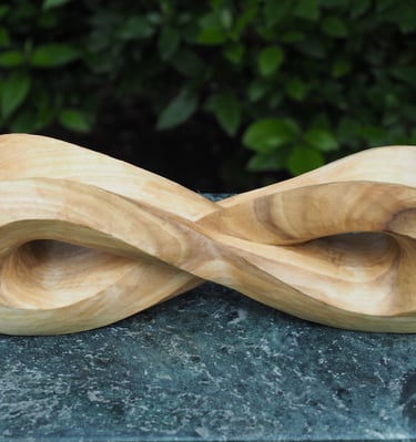 'Infinity Mobius' - abstract sculpture in tulip wood.by Sarah Liptrot