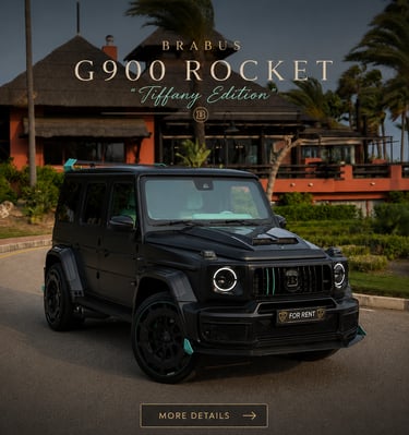 A custom Brabus G900 Rocket Tiffany Edition luxury SUV in matte black parked at an exotic tropical resort.