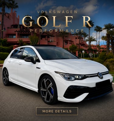 White Volkswagen Golf R Performance hatchback parked at a tropical luxury resort with palm trees.