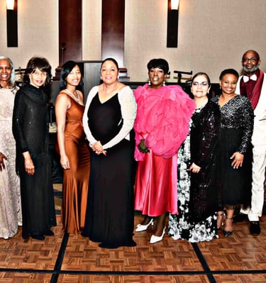 a group of people standing in front of a stage for GFW MLK Jr. Community Event
