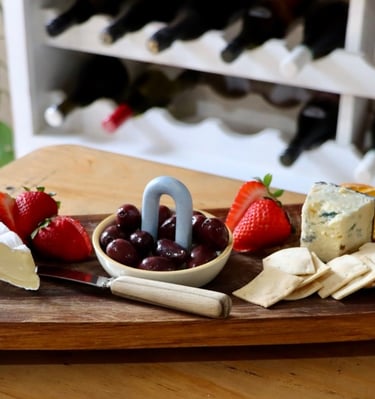 cheese platter with dehydrated fruit on it for garnish