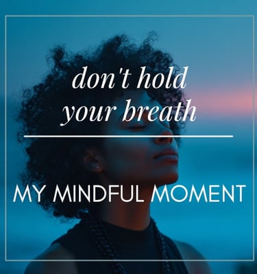 a woman with her hair in a black top and a blue sky background with the