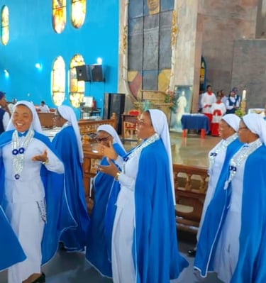 Catholic nuns in blue and white habits singing and dancing during a church service or ceremony.