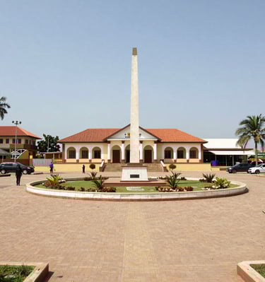 Traditional dancers performing in colorful attire at an outdoor festival.