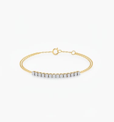 Elegant gold chain bracelet featuring a row of shimmering round-cut diamonds on a white background.