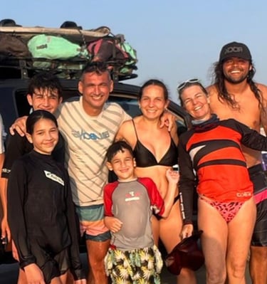 Happy family after a long day of kiting in Guriu