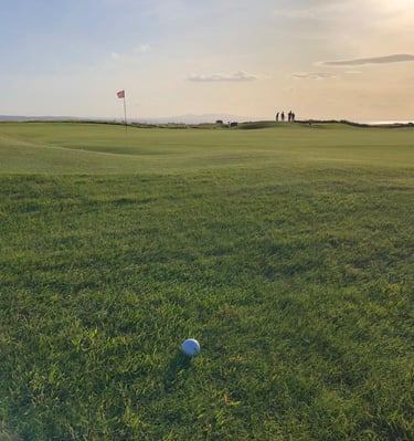 a golf ball lying in semi rough