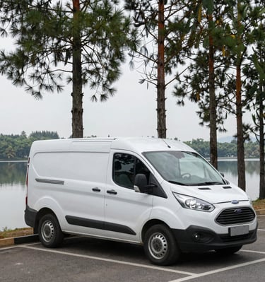 A bright blue van parked by a serene lake reflecting tall pine trees