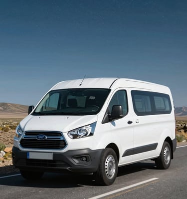 A sunlit desert campsite beside a vibrant orange van under a starry sky