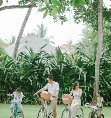 Family cycling session at The Westin Resort Nusa Dua Bali during morning light