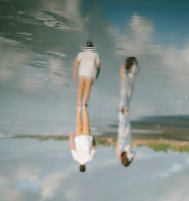 Intimate couple portrait at Pantai Nyanyi Bali with artistic reflection