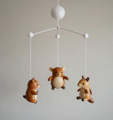 A whimsical underwater scene with soft blue hues and hanging sea creature mobiles.