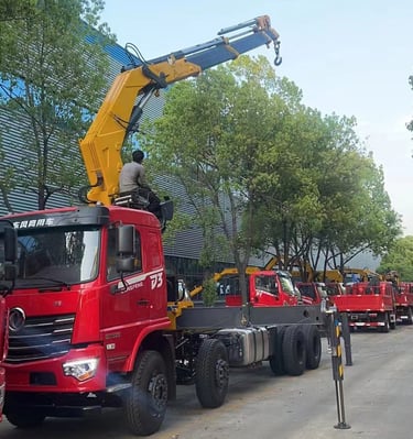 Image of a crane truck with a 16 Ton Knuckle Lorry Loader Crane on white background.