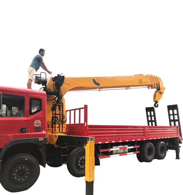 A man standing on top of a 14 ton Telescopic Boom Truck Mounted Crane with 4 section arms.