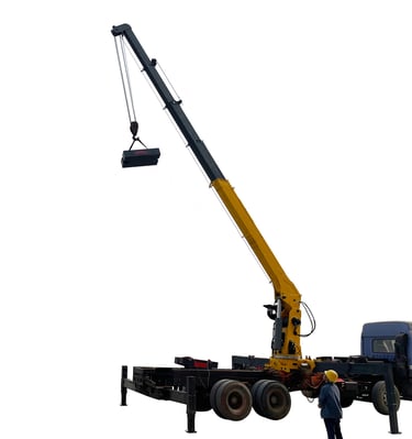 A man standing next to a 10 ton Telescopic Boom Truck Mounted Crane lifting a large object with 5 section arms.