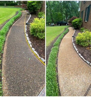 Before and after pressure washing a curved aggregate concrete walkway next to a brick house and lawn.