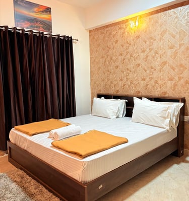 a bed with two pillows and a blanket on it